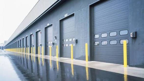 Commercial loading dock with multiple overhead doors