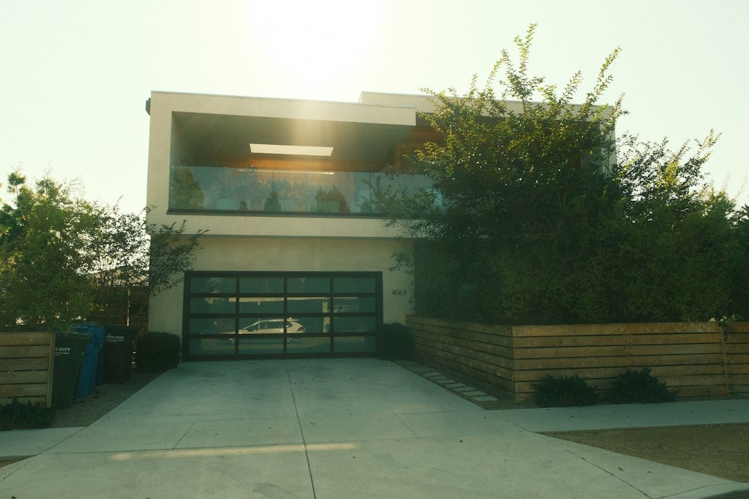 Contemporary home with a glass garage door